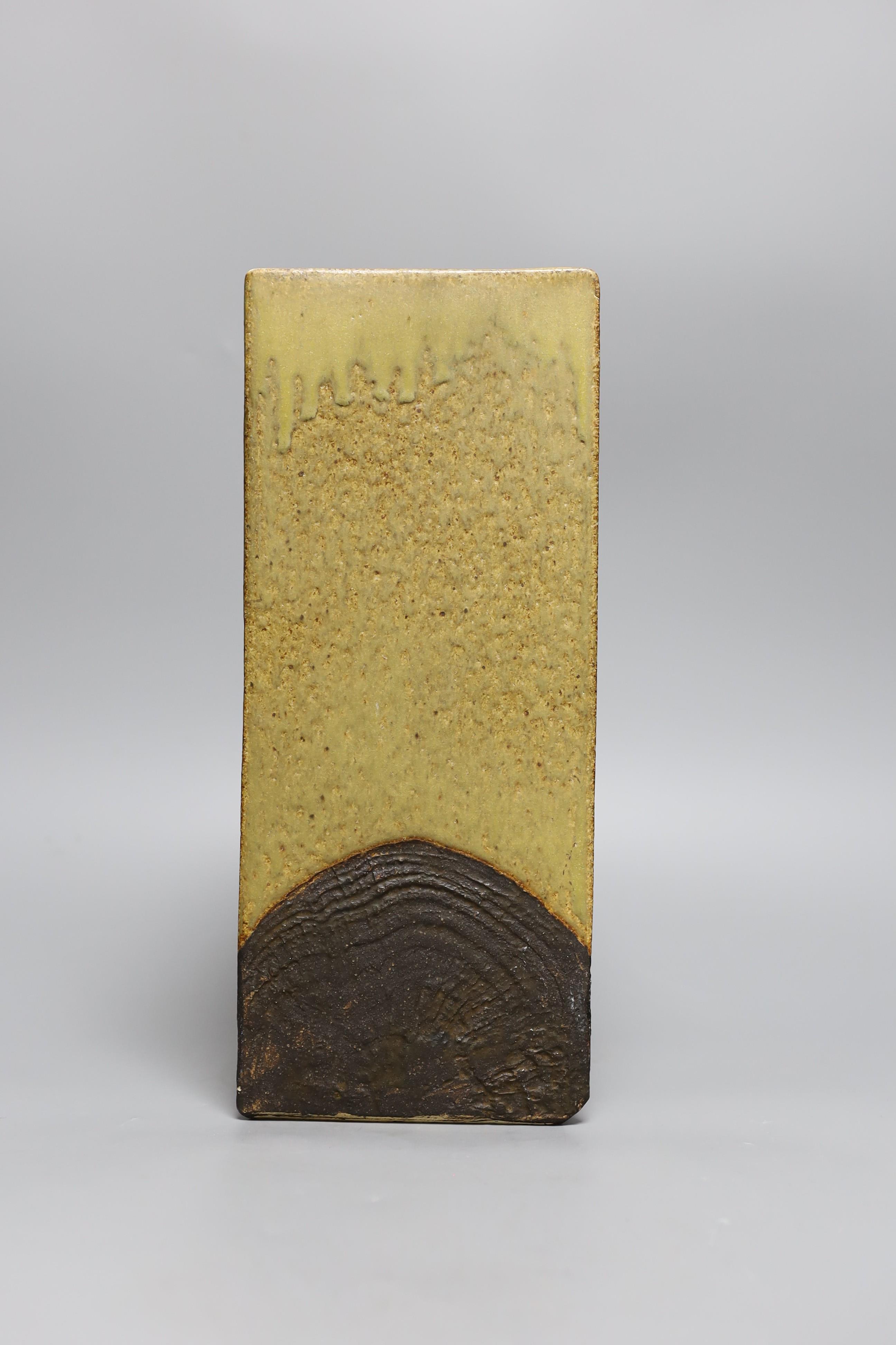 A glazed pottery triangular vase, inscribed Troika England 33cms high